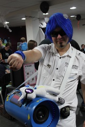 Size: 3456x5184 | Tagged: safe, dj pon-3, vinyl scratch, human, g4, bass cannon, convention, cosplay, hoofbump, irl, irl human, photo, plushie