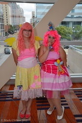 Size: 4912x7360 | Tagged: safe, artist:washuotaku, fluttershy, pinkie pie, human, g4, absurd resolution, cosplay, flats, glasses, irl, irl human, otakon, otakon 2012, party horn, photo