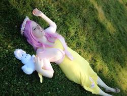Size: 720x540 | Tagged: safe, artist:mintyblitzz, angel bunny, fluttershy, human, g4, cosplay, female, flats, floral head wreath, grass, irl, irl human, on back, photo, plushie, sleeping, solo, winged humanization
