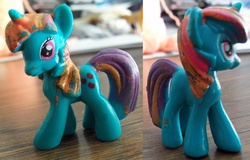 Size: 1410x900 | Tagged: safe, twilight sparkle, pony, undead, zombie, zombie pony, g4, blind bag, bootleg, irl, photo, quality, swapped cutie marks, toy