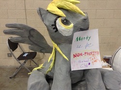 Size: 500x373 | Tagged: safe, derpy hooves, pegasus, pony, g4, female, looking up, mare, model, mouth hold, paper, photo, piñata, sitting, solo