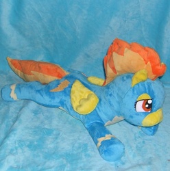 Size: 800x808 | Tagged: safe, artist:bladespark, spitfire, pegasus, pony, g4, beanie (plushie), clothes, folded wings, irl, lying down, photo, plushie, prone, solo, uniform, wings, wonderbolts uniform