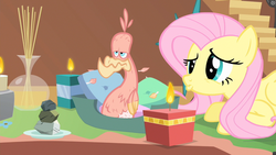 Size: 1600x900 | Tagged: safe, screencap, fluttershy, philomena, bird, pegasus, phoenix, pony, a bird in the hoof, g4, aromatherapy, candle, duo, female, fire, mare, plate, pouting, rock