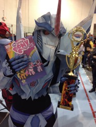 Size: 2448x3264 | Tagged: source needed, safe, idw, human, brony, comic, convention, cosplay, irl, irl human, merchandise, photo, starscream, transformers, transformers prime, trophy