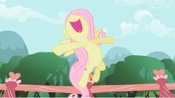 Size: 1366x768 | Tagged: safe, screencap, fluttershy, pegasus, pony, g4, female, flying, happy, mare, open mouth, singing, solo, volumetric mouth