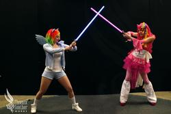 Size: 2000x1333 | Tagged: safe, artist:enjinight, pinkie pie, rainbow dash, human, g4, cosplay, irl, irl human, lightsaber, photo