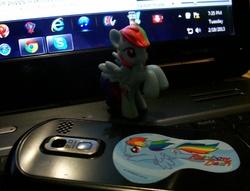 Size: 598x458 | Tagged: safe, rainbow dash, g4, blind bag, computer, irl, laptop computer, microsoft windows, phone, photo, sticker, toy, windows 7