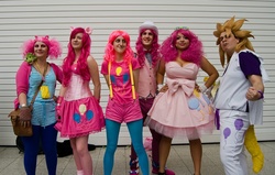 Size: 2048x1301 | Tagged: safe, artist:gavinclinton, pinkie pie, surprise, human, g4, bowtie, bubble berry, clothes, corset, cosplay, group photo, irl, irl human, london mcm expo, photo, rule 63, suspenders