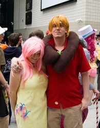 Size: 1249x1600 | Tagged: safe, big macintosh, fluttershy, human, g4, arm around neck, convention, cosplay, female, hand on shoulder, irl, irl human, london mcm expo, looking at you, male, photo, ship:fluttermac, shipping, straight