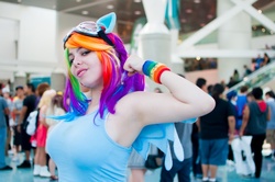 Size: 1072x712 | Tagged: safe, artist:geekeryandsuch, rainbow dash, human, g4, anime expo, anime expo 2013, big breasts, breasts, busty rainbow dash, convention, cosplay, flexing, goggles, irl, irl human, multicolored hair, photo, rainboob dashie ali, rainbow hair, wristband