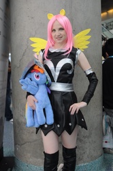 Size: 712x1072 | Tagged: safe, artist:onlyfactory, fluttershy, private pansy, human, g4, anime expo, anime expo 2012, armor, armor skirt, bootleg, boots, clothes, cosplay, irl, irl human, photo, plushie, shoes, skirt, solo