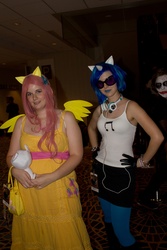 Size: 2581x3872 | Tagged: artist needed, safe, artist:selovell, dj pon-3, fluttershy, vinyl scratch, human, g4, 2012, clothes, cosplay, dragon con, gloves, headphones, irl, irl human, photo, photobomb, plushie, sunglasses, the joker