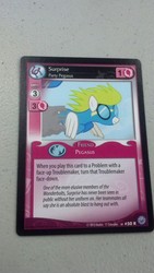 Size: 722x1280 | Tagged: safe, enterplay, surprise (g4), pegasus, pony, g4, my little pony collectible card game, premiere, card game, ccg, female, irl, mare, name, photo, smiling, wonderbolts