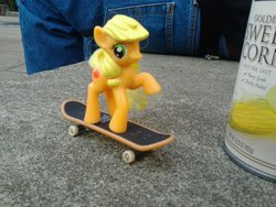 Size: 900x675 | Tagged: safe, applejack, human, g4, corn, irl, irl human, photo, skateboard, tech deck, toy