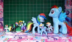 Size: 1000x591 | Tagged: safe, rainbow dash, g4, beanie babies, blind bag, clothes, costume, funko, irl, mcdonald's happy meal toys, mystery minis, photo, plushie, rearing, shadowbolt dash, shadowbolts, shadowbolts costume, size comparison, toy