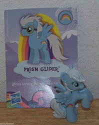 Size: 769x972 | Tagged: safe, prism glider, prism strider, rainbow dash, soarin', pegasus, pony, g4, official, blind bag, card, female, figure, goggles, irl, logo, mare, photo, reverse trap, rule 63, soarin' base, toy