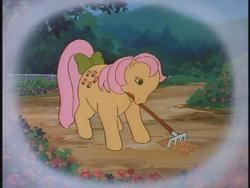 Size: 640x480 | Tagged: safe, screencap, posey, earth pony, pony, g1, my little pony 'n friends, bow, garden, gardening, hoe (tool), mirror, mouth hold, rake, solo, tail, tail bow