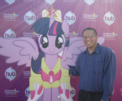 Size: 983x813 | Tagged: safe, twilight sparkle, alicorn, human, pony, g4, cardboard cutout, cardboard twilight, clothes, dress, female, irl, john joseco, mare, photo, twilight sparkle (alicorn)