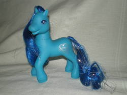 Size: 640x480 | Tagged: safe, photographer:lancer, prince blue dream, earth pony, pony, g2, irl, male, photo, smiling, solo, stallion, tinsel in mane, toy