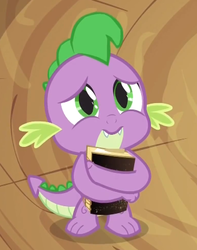 Size: 342x434 | Tagged: safe, screencap, spike, dragon, g4, magical mystery cure, baby, baby dragon, book, cute, fangs, green eyes, holding, male, sad, sadorable, scales, solo, spikabetes