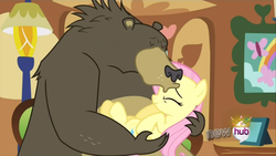 Size: 1440x810 | Tagged: safe, screencap, fluttershy, harry, bear, pony, g4, magical mystery cure, season 3, animal, carrying, cute, duo, eyes closed, female, forehead kiss, harrybetes, hub logo, kissing, mare, platonic kiss, shyabetes, wrong cutie mark