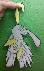 Size: 701x1140 | Tagged: dead source, safe, artist:winter-hooves, derpy hooves, pegasus, pony, g4, cute, female, hand, hanging, mare, paper child, paper pony, papercraft, photo, solo, spread wings, tail, tail pull, traditional art