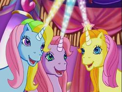 Size: 640x480 | Tagged: safe, screencap, brights brightly, cheerilee (g3), whistle wishes, pony, unicorn, g3, the runaway rainbow, adorabrights, castle, crystal rainbow castle, cute, female, g3 cheeribetes, g3 whistlebetes, indoors, laser, magic, magic blast, mare, open mouth, open smile, smiling, trio, unicornia