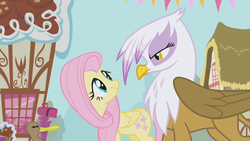 Size: 1280x720 | Tagged: safe, screencap, fluttershy, gilda, duck, griffon, g4, griffon the brush off, season 1, eye contact, glare, house, looking at each other, mailbox, moments before disaster, this will end in tears