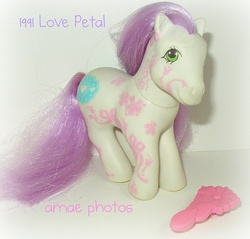 Size: 640x611 | Tagged: safe, love petal, earth pony, pony, g1, brush, comb, female, flower fantasy ponies, irl, looking at you, mare, photo, smiling, solo, tail, toy