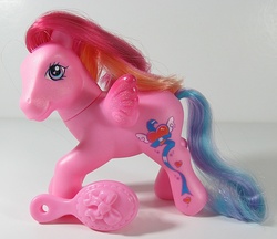Size: 696x600 | Tagged: safe, photographer:breyer600, twilight pink, pegasus, pony, g3, colored wings, comb, female, gradient wings, irl, mare, photo, solo, toy, wings