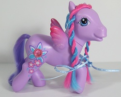 Size: 754x600 | Tagged: safe, photographer:breyer600, windy wisp, pegasus, pony, g3, braid, colored wings, female, gradient wings, irl, mare, photo, ribbon, solo, toy, wings