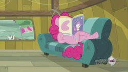 Size: 640x360 | Tagged: safe, screencap, pinkie pie, earth pony, pony, g4, one bad apple, book, couch, female, hub logo, hubble, magazine, reading, solo