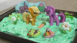 Size: 1768x998 | Tagged: safe, applejack, twilight sparkle, g4, barn, birthday, birthday cake, cake, dessert, figure, gift set, hatless, irl, missing accessory, my little pony logo, photo, picnic, toy