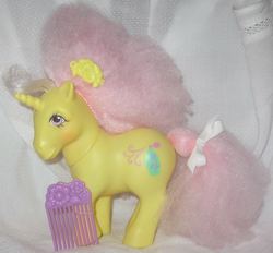 Size: 1024x950 | Tagged: safe, red roses, pony, unicorn, g1, blushing, comb, cutie mark, female, hooves, horn, irl, mare, perfume puff, photo, ribbon, solo, toy