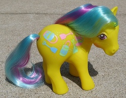 Size: 773x600 | Tagged: safe, photographer:breyer600, sand digger, earth pony, pony, g1, blushing, female, irl, outdoors, photo, solo, sunshine pony, tail, toy