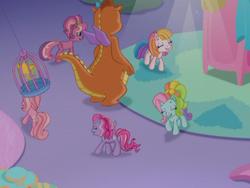Size: 640x480 | Tagged: safe, screencap, cheerilee (g3), pinkie pie (g3), rainbow dash (g3), starsong, toola-roola, twinkle wish, whimsey weatherbe, dragon, pony, g3, g3.5, twinkle wish adventure, cage, circle, female, mare, surrounded, that's what makes a friend