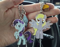 Size: 814x649 | Tagged: safe, derpy hooves, rarity, pegasus, pony, g4, female, hot topic, irl, jewelry, mare, merchandise, necklace, photo