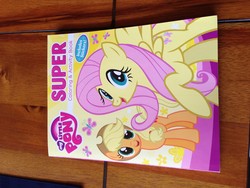 Size: 3264x2448 | Tagged: safe, applejack, fluttershy, g4, book, irl, merchandise, photo, sideways image