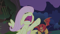 Size: 640x360 | Tagged: safe, screencap, fluttershy, manny roar, manticore, pegasus, pony, friendship is magic, g4, everfree forest, flying, mawshot, open mouth, screaming, stop, uvula, wait