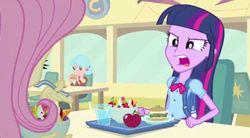 Size: 592x327 | Tagged: safe, screencap, carla jr., fluttershy, twilight sparkle, human, equestria girls, g4, my little pony equestria girls, apple, background character, background human, backpack, badge, bowl, chair, clothes, cup, ear piercing, earring, eating, female, food, fruit salad, glass of water, hair bun, jewelry, pants, piercing, plate, salad, sandwich, shirt, sitting, spoon, table, tray