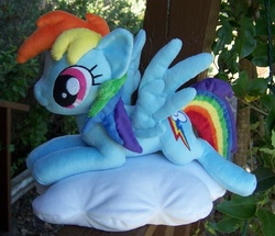 Size: 902x777 | Tagged: safe, artist:helgafuggly, rainbow dash, pegasus, pony, g4, cloud, irl, lying down, lying on a cloud, on a cloud, outdoors, photo, pillow, plushie, prone, spread wings, wings