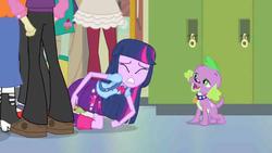Size: 854x480 | Tagged: safe, screencap, blueberry cake, golden hazel, nolan north, rose heart, sophisticata, spike, twilight sparkle, dog, human, equestria girls, g4, my little pony equestria girls, background character, background human, backpack, clothes, collar, constipated, dog collar, faic, female, lockers, male, pants, shirt, shoes, skirt, spike the dog, stoner spike