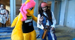 Size: 1600x870 | Tagged: safe, fluttershy, human, g4, assassin's creed, cosplay, costume, furry, fursuit, irl, irl human, jack sparrow, photo, pirate