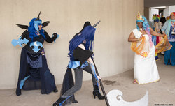 Size: 1000x609 | Tagged: safe, artist:checkerboardprincess, nightmare moon, princess celestia, human, g4, acen, armor, convention, cosplay, day, fight, irl, irl human, photo, weapon