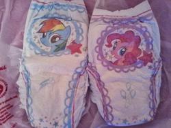 Size: 700x525 | Tagged: safe, pinkie pie, rainbow dash, earth pony, pegasus, pony, g4, official, diaper, irl, merchandise, photo, pinkie pie's cutie mark, pullup (diaper), rainbow dash's cutie mark, stars, walgreens