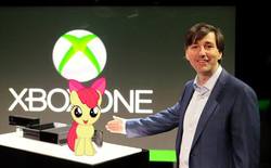 Size: 720x447 | Tagged: safe, apple bloom, human, pony, g4, duo, irl, photo, ponies in real life, standing, xbox one