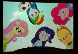 Size: 476x328 | Tagged: safe, screencap, applejack, fluttershy, pinkie pie, rainbow dash, rarity, equestria girls, g4, my little pony equestria girls, :c, bad quality, female, football, huddle shot, humane five, photo, picture of a screen, pov