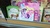 Size: 2592x1456 | Tagged: safe, applejack, pinkie pie, rainbow dash, twilight sparkle, earth pony, human, pegasus, pony, unicorn, g4, backpack, backpack (dora the explorer), book, boots the monkey, dora márquez, dora the explorer, female, irl, looking at you, mare, merchandise, photo, smiling, special face, swiper the fox, touch and feel ponies