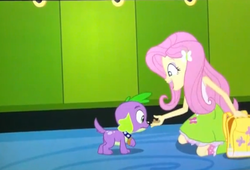 Size: 481x328 | Tagged: safe, screencap, fluttershy, spike, dog, equestria girls, g4, my little pony equestria girls, backpack, cropped, dog treat, duo, food, spike the dog