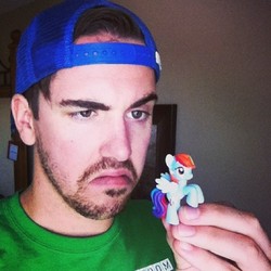 Size: 500x500 | Tagged: safe, rainbow dash, human, g4, blind bag, brony, irl, irl human, photo, solo, toy, unimpressed